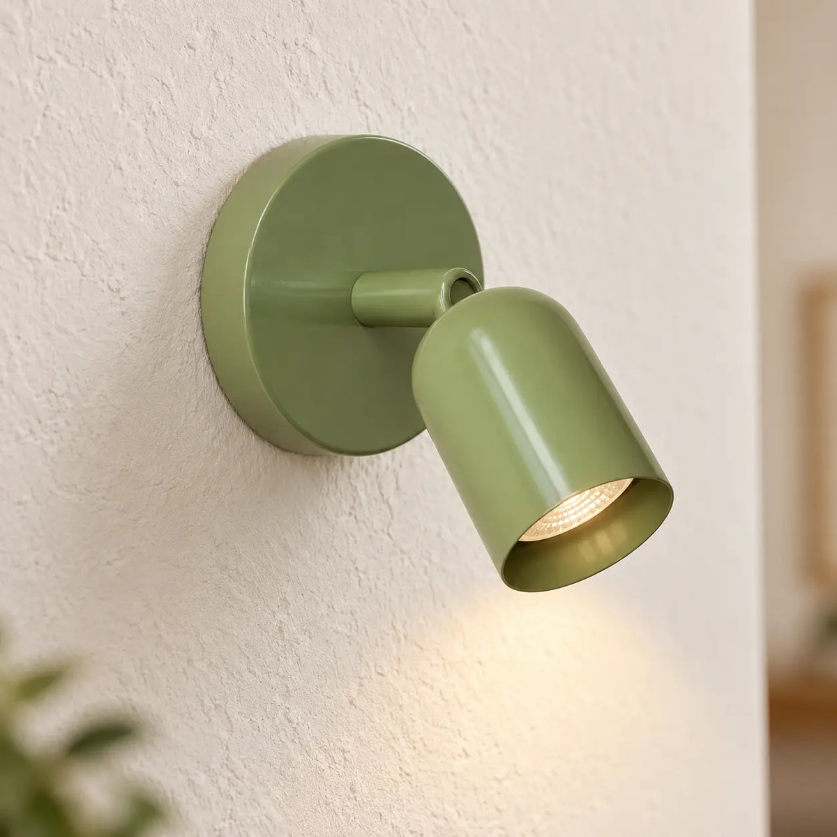 Détail de l’applique murale tête de lit verte orientable
