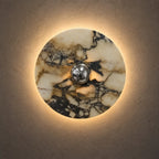 Halo lumineux chaud de l’applique ronde en marbre